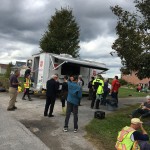 volunteers wait and talk at the canteen truck